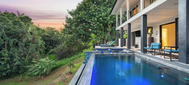 Newly built home in the heart of Princeville offering a modern luxury design with unmatched tranquility!