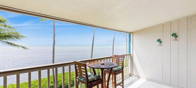 Take In Water Views from a Third-Floor Oceanfront Condo with Pool
