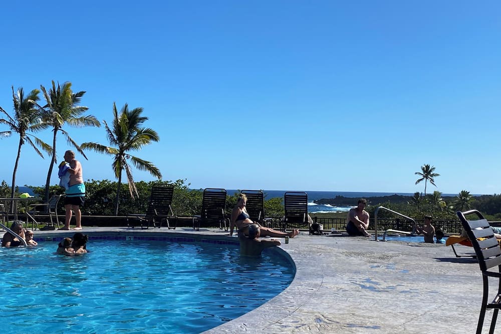 Punaluu Condo | Secluded , cozy poolside getaway. Ocean views, near black sand beach & turtles.