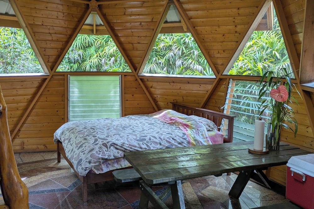 Orchidlands Estates Cottage | Solar powered bohemian loft cottage with birds, lizards, and frogs