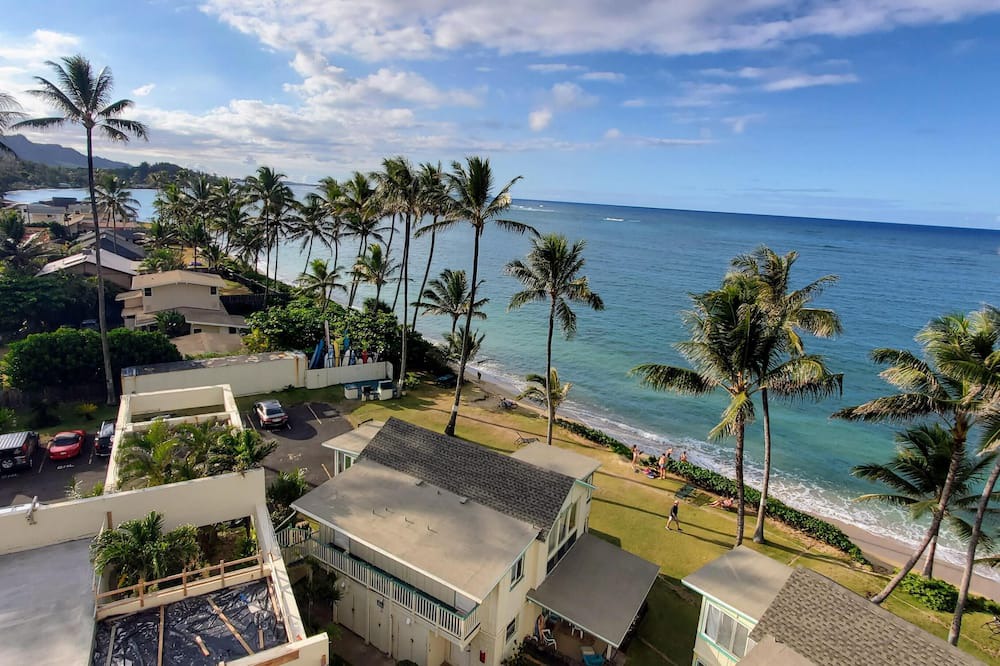 Punaluu Condo | Beach Front Condo w/Beautiful Sunrises on Private Sandy Beach with Calm & Gentle Waves