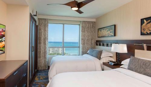 One-Bedroom Luxury Suite with Two Double Beds and Ocean View