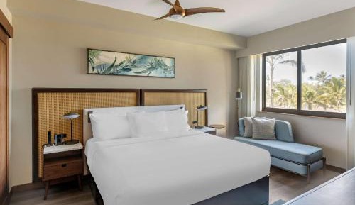Two-Bedroom Deluxe King Suite with Two Double Beds and Partial Ocean View